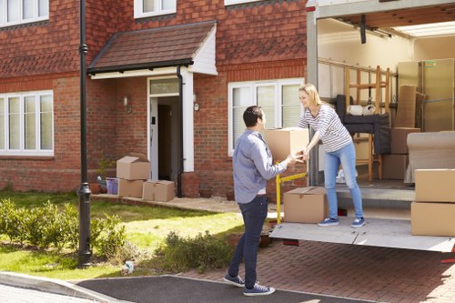 Furniture removals team working in a Maida Vale residential street