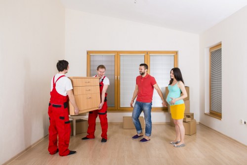 Professional loading of wrapped furniture into a removals van