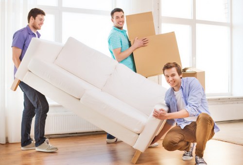 Local movers handling fragile items during a West London move