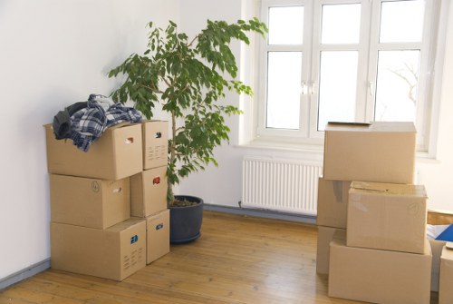 Professional moving team organizing belongings for transport in Maida Vale