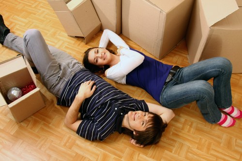 Trained movers carrying furniture with care in Maida Vale